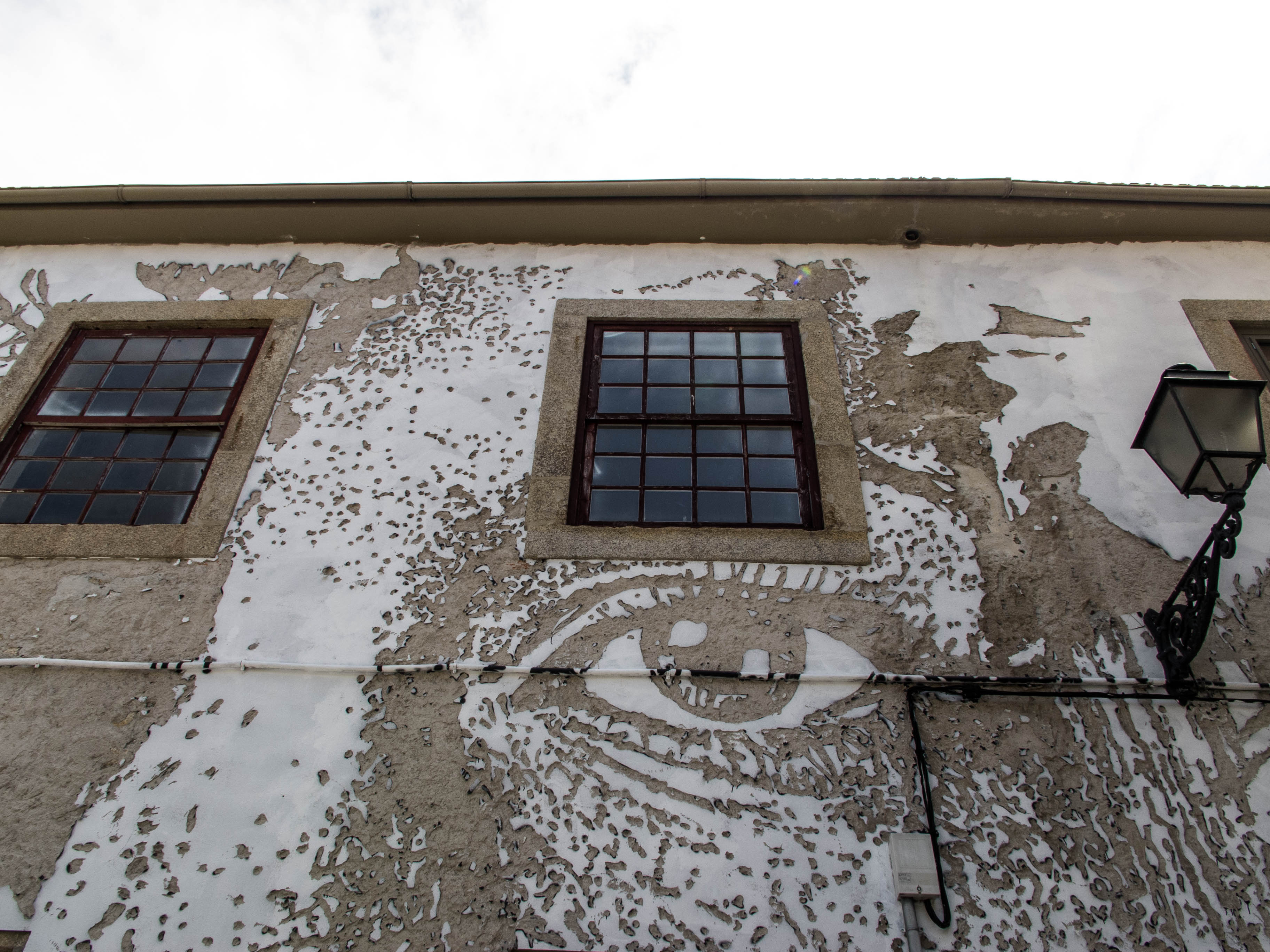Carved wall by Vhils