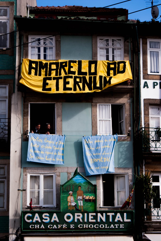 Banners on the windows of 19th century buildings in Clérigos area