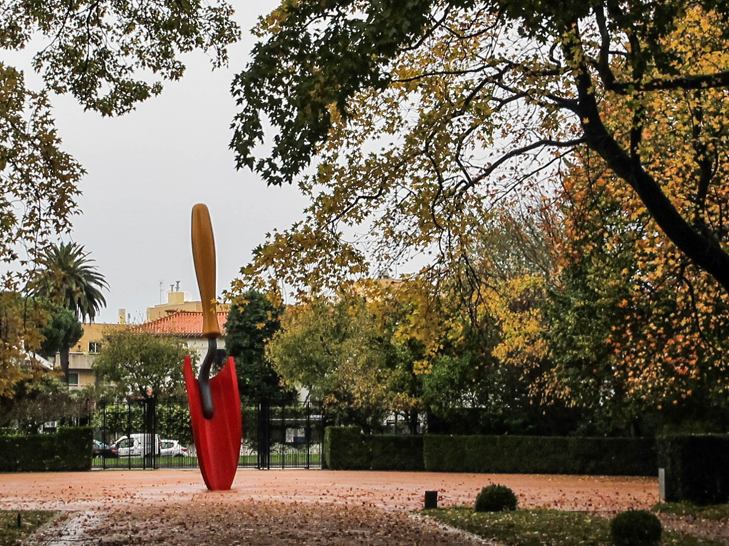 A red trowel stands at the entrance of the park
